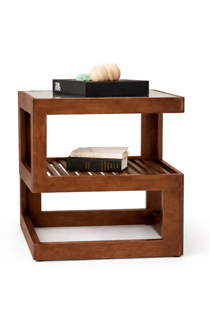 Modern walnut end table with décor.webp